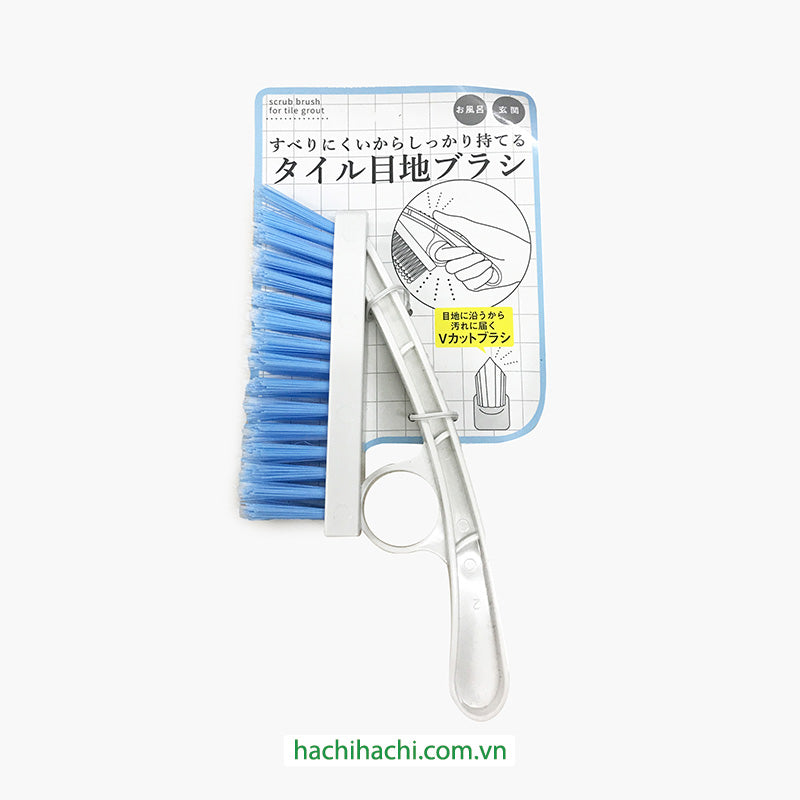 Tile grout brush that can be held ﬁrmly
