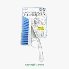 Tile grout brush that can be held ﬁrmly