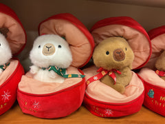 Capybara toy with “Merry Christmas” bag